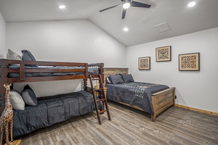 Inspira Ranch apartment private bedroom with rustic furnishings and comfortable bedding